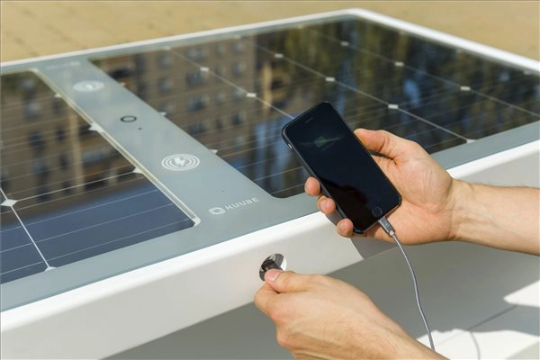 Kuube Nano solar smart bench with integrated USB charging port and solar panel surface